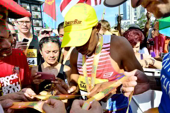 SAN DIEGO, CA - JUNE 01: Boston Marathon winner Meb Keflezighi signs autographs for fans at the Suja Rock 'n' Roll San Diego Marathon & Half Marathon benefitting the Leukemia & Lymphoma Society on June 1, 2014 in San Diego, California. (Photo by Jerod Harris/Getty Images for Rock 'n' Roll Marathon Series)