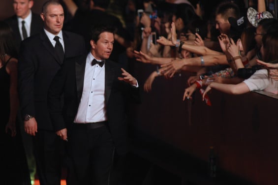 SHANGHAI, CHINA - JUNE 22: Mark Wahlberg waves hand to fans attending the red carpet for the worldwide premiere screening of 'Transformers: Age of Extinction' on June 22, 2014 in Shanghai, China. (Photo by Hong Wu/Getty Images for Paramount)