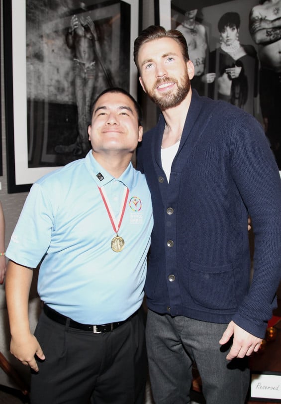 LOS ANGELES, CA - FEBRUARY 21: 2015 Special Olympics World Games Global Messanger Joseph Gorin (L) and Actor Chris Evans attend CW3PR presents Gold Meets Golden at Equinox Sports Club on February 21, 2015 in Los Angeles, California. (Photo by Rachel Murray/Getty Images for CW3PR Gold Meets Golden)