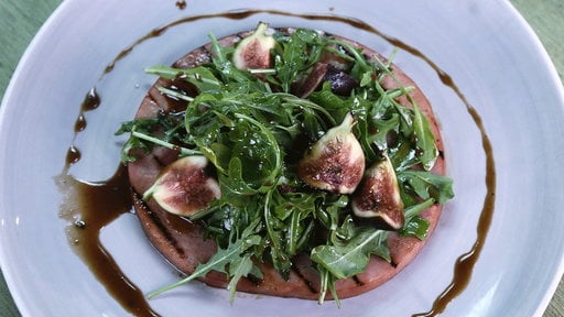 Learn how to make the brunch inspired grilled ham steak with figs and arugula that chef Michael Symon made on "The Chew" on Monday, April 13, 2015.
