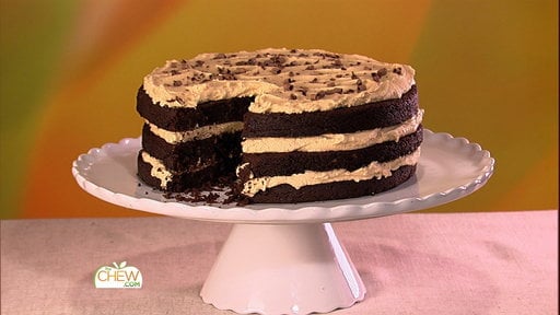 Learn how to make the delicious flourless peanut butter layer cake that chef Carla Hall, chef Michael Symon and viewer Niah made on "The Chew" on Monday, May 4, 2015.