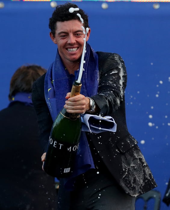 AUCHTERARDER, SCOTLAND - SEPTEMBER 28: Rory McIlroy of Europe celebrates winning the Ryder Cup by spraying champagne after the Singles Matches of the 2014 Ryder Cup on the PGA Centenary course at the Gleneagles Hotel on September 28, 2014 in Auchterarder, Scotland. (Photo by Mike Ehrmann/Getty Images)