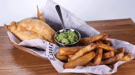 Learn how to make the delicious beer battered fish 'n' chips with mushy peas that country singer Sarah Evans and chef Michael Symon made on "The Chew" on Thursday, March 26th, 2015.