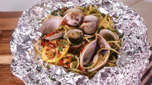 Learn how to make the delicious spaghetti and clams foil pack that Clinton Kelly and "Pitch Perfect 2" star Brittany Snow made on "The Chew" on Friday, May 15th.