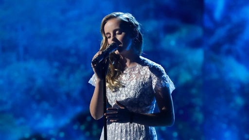 Watch America's Got Talent Season 12 Episode 23 Live Show Finale Videos: Tuesday, September 19, 2017. My heart broke for singer Evie Clair when her beloved father passed away recently from cancer. She is such a brave, talented, strong and inspiring young lady. Tonight she honored her dad by singing Louis Armstrong's "What A Wonderful World". It was absolutely beautiful. Her standing ovation was very well deserved. Well done, Evie. God bless you and your family.