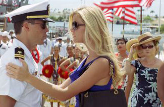 Taylor Kitsch stars and Hooper and Brooklyn Decker stars as his fiancee Sam Shane in the movie Battleship.