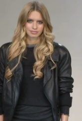 Fall casual look accessorized with a black leather jacket and long wavy locks.