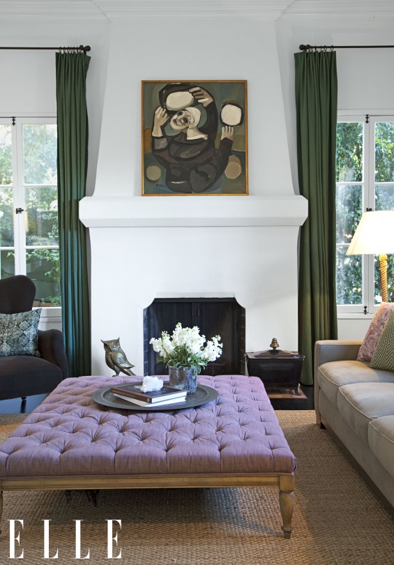 I adore Ginnifer's white living room with casual pops of color, a stunning white fireplace, a mauve tufted ottoman, gorgeous French doors and a vintage owl. Hilary Walsh / ELLE