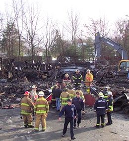 Firefighters at the scene of the Station Nightclub Fire that took place in February 2003. 100 people lost their lives in this tragedy.