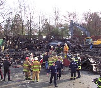 Firefighters at the scene of the Station Nightclub Fire that took place in February 2003. 100 people lost their lives in this tragedy.