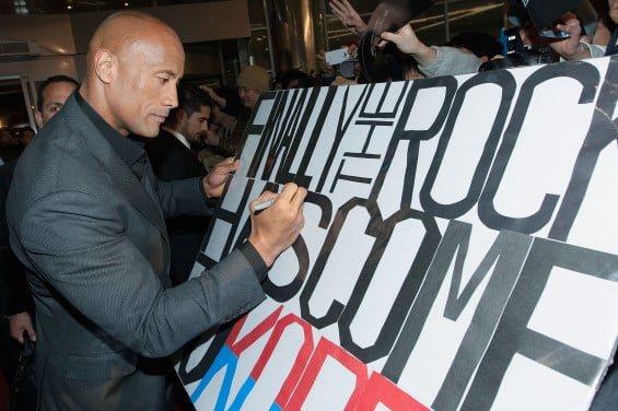  SEOUL, SOUTH KOREA - MARCH 11: Actor Dwayne Johnson signs autographs for fans during the 'G.I. Joe - Retaliation' Seoul World Premiere at Times Square on March 11, 2013 in Seoul, South Korea. (Photo by Han Myung-Gu/Getty Images for Paramount Pictures)