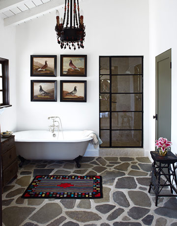 Bathroom The bathroom floor is made of Ojai river rock. "It's so strong, you could build a Hyatt Regency on it," McDowell says. She designed the shower door in the style of a metal casement window. Shower faucet by Sunrise Specialty. Cast-iron tub from the Tub Connection. Read more: Spanish Style Homes - Country House Decorating - House Beautiful 