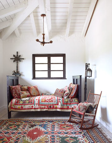 Guest Bedroom A Suzani quilt and kilim pillows give the guest room's Spanish Colonial-style daybed a dose of global pizzazz. The lantern is an early California cowboy lamp. Read more: Spanish Style Homes - Country House Decorating - House Beautiful 