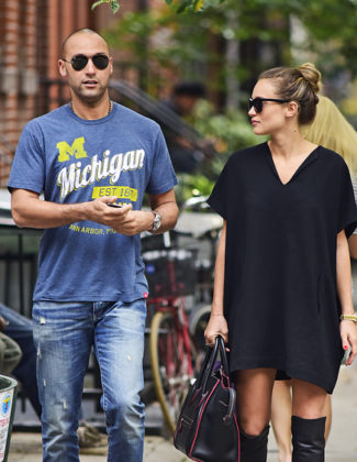 Retired New York Yankees shortstop Derek Jeter and girlfriend Hannah Davis (in a trendy oversized dress and over the knee boots) in New York City! Photo credit: Pacific Coast News. Image courtesy of People.com