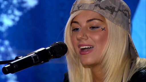 Idol Auditions: Jax! her Lil' Wayne face tattoo and backwards cap did not suggest a slowed-down performance of The Beatles "I want to hold your hand". 