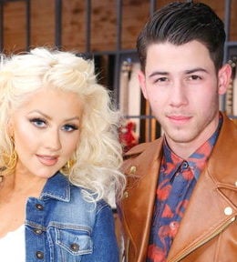 Pop sensation Christina Aguilera and team advisor Nick Jonas are looking to bring their team to victory on "The Voice" season 8.