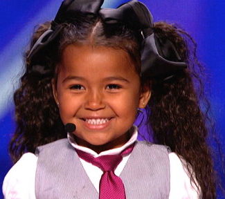 Watch America's Got Talent! Adorable five year old Heavenly Joy Jerkins (a young Shirley Temple) taps and sings her way to the next round. I think she's ready for her Broadway debut! :)