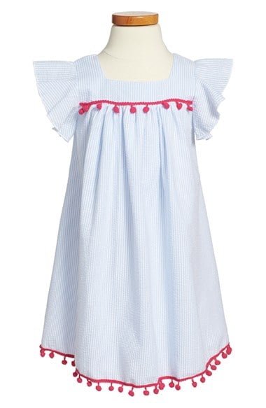 Mignone Flutter Sleeve Seersucker Dress (Toddler Girls, Little Girls and Big Girls) in White and Blue with Pink Pom Poms
