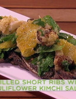 Watch chef Michael Symon show fabulous cook and Steph Curry's better half, Mrs. Ayesha Curry how to make grilled short ribs with cauliflower kimchi salad on the Wednesday, February 8, 2017 episode of "The Chew."