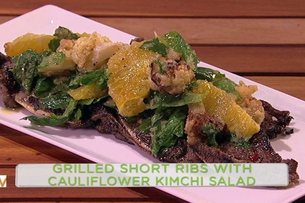 Watch chef Michael Symon show fabulous cook and Steph Curry's better half, Mrs. Ayesha Curry how to make grilled short ribs with cauliflower kimchi salad on the Wednesday, February 8, 2017 episode of "The Chew."