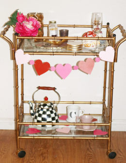 Candace Rose decorated her Valentine's Day bar cart with an agate cheeseboard, Mackenzie-Childs teak kettle, tea cups and a heart garland on Candie Anderson blog candieanderson.com blog