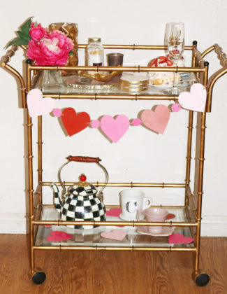 Candace Rose decorated her Valentine's Day bar cart with an agate cheeseboard, Mackenzie-Childs teak kettle, tea cups and a heart garland on Candie Anderson blog candieanderson.com blog