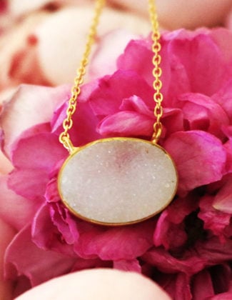fashion and lifestyle blogger candace rose shares rosecandi garden roses and her crown jewelry white druzy necklace.