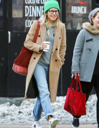 Sienna Miller Gucci Sneakers New York, NY - *EXCLUSIVE* - Sienna Miller enjoys her morning caffeine fix as she hangs out with a friend in NY wearing a beige trench coat over a gray sweater, boyfriend jeans, Gucci sneakers and a cool looking bright green beanie.