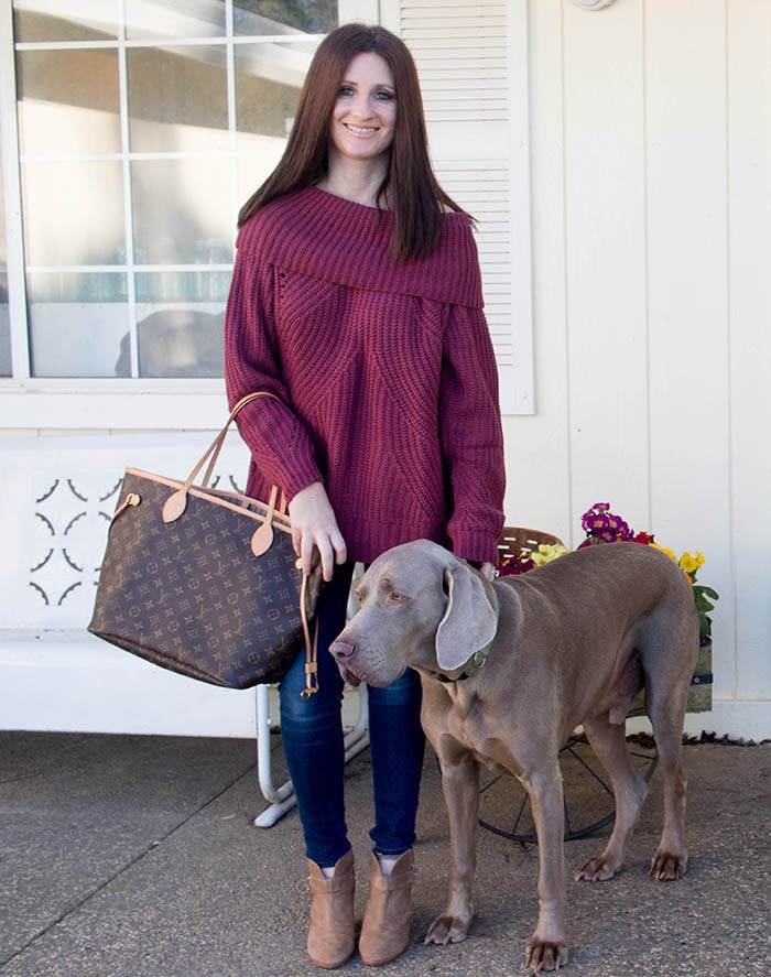 Candace Rose Anderson of CandieAnderson.com wears a wine color Tobi off the shoulder sweater while posing with her Weimaraner Fred.