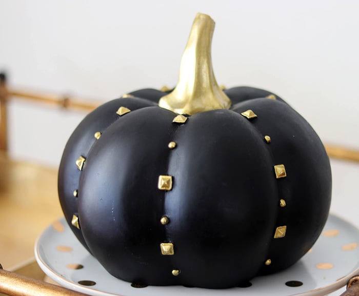 Candie Anderson black pumpkin with gold studs for fall. 