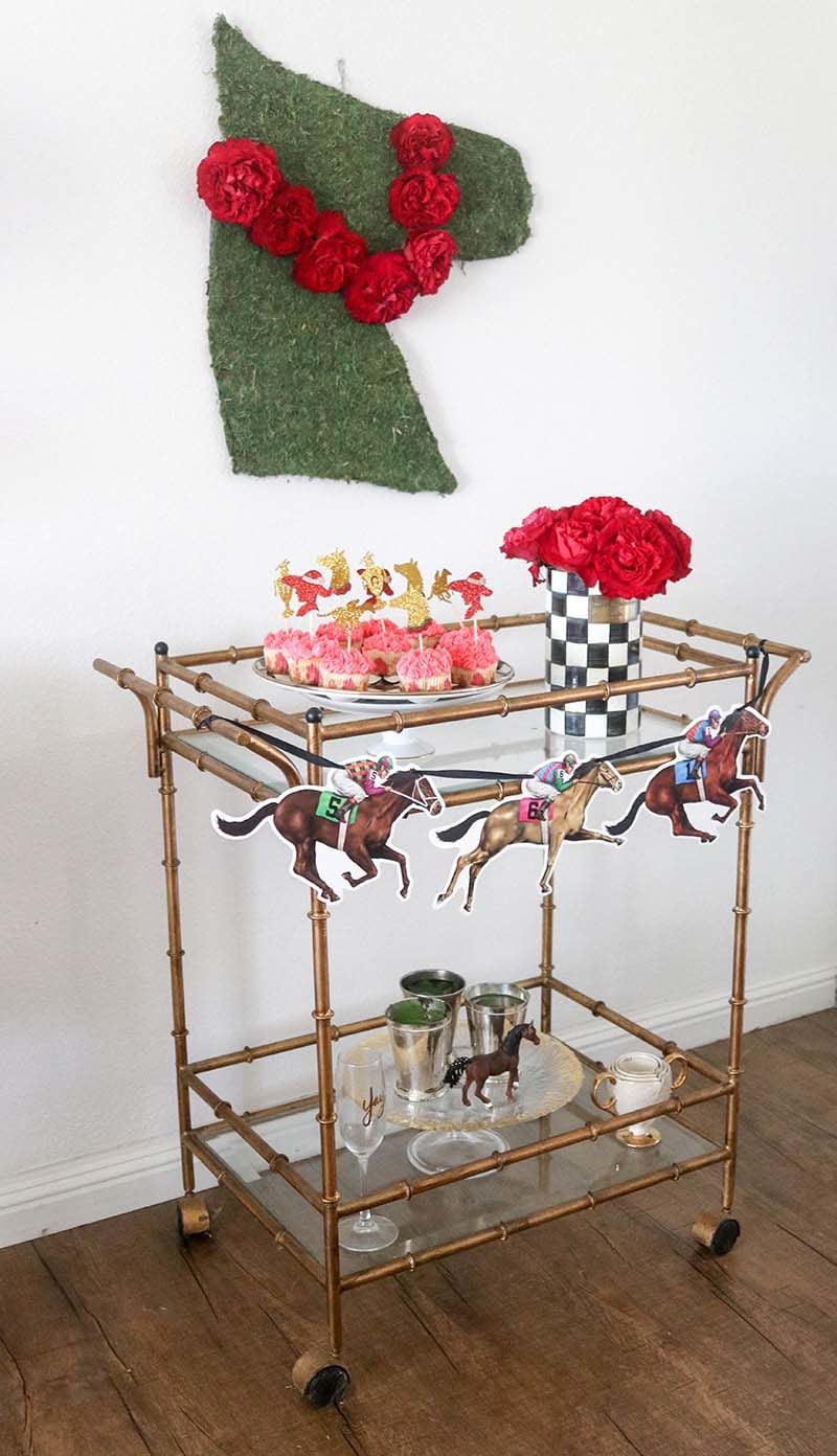 Lifestyle expert and blogger, Candie Anderson has the scoop on how to decorate your gold bar cart for the Kentucky Derby with Mackenzie Childs, cupcakes, and mint juleps.