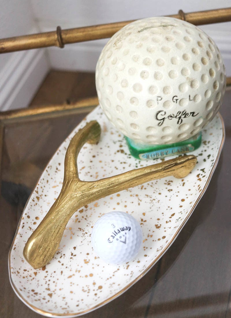 Lifestyle blogger Candie Anderson has the scoop on golf related decor including a Callaway golf ball, a vintage golf ball bank and a gold wishbone for luck.