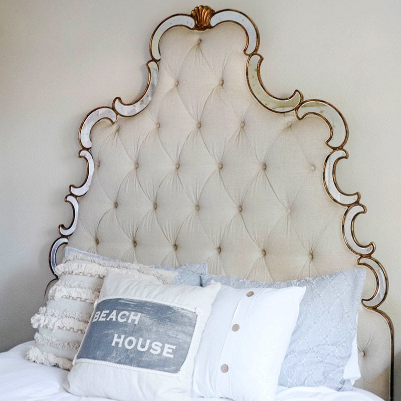 Lifestyle expert Candie Anderson has the scoop on how to decorate your bedroom with trendy yet affordable coastal inspired pillows including this beautiful Rizzy Home Beach House pillow with rope trim detailing.