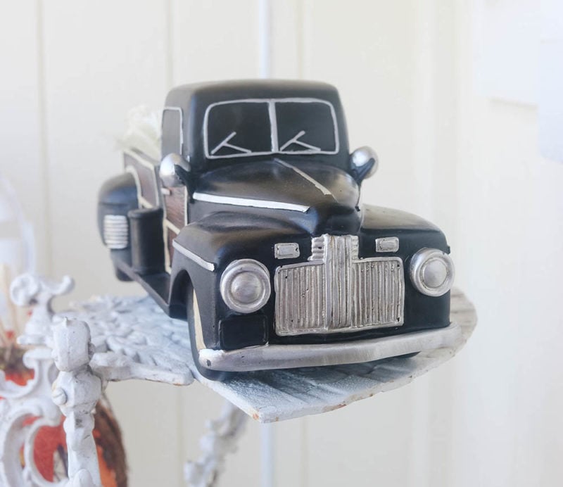 Lifestyle expert and blogger Candie Anderson decorates with a 1. Pickup truck Holiday TIme Thanksgiving Multicolor Vintage Look Pumpkin Truck Tabletop Decoration (12.5 in). It looks great on her farmhouse fall front porch. This item is available at Walmart.