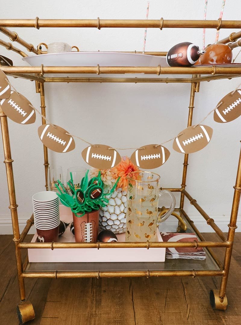 Lifestyle expert, blogger and journalist Candie Anderson has the scoop on how to create a fun and festive football dessert cart with party decor and glam accessories.