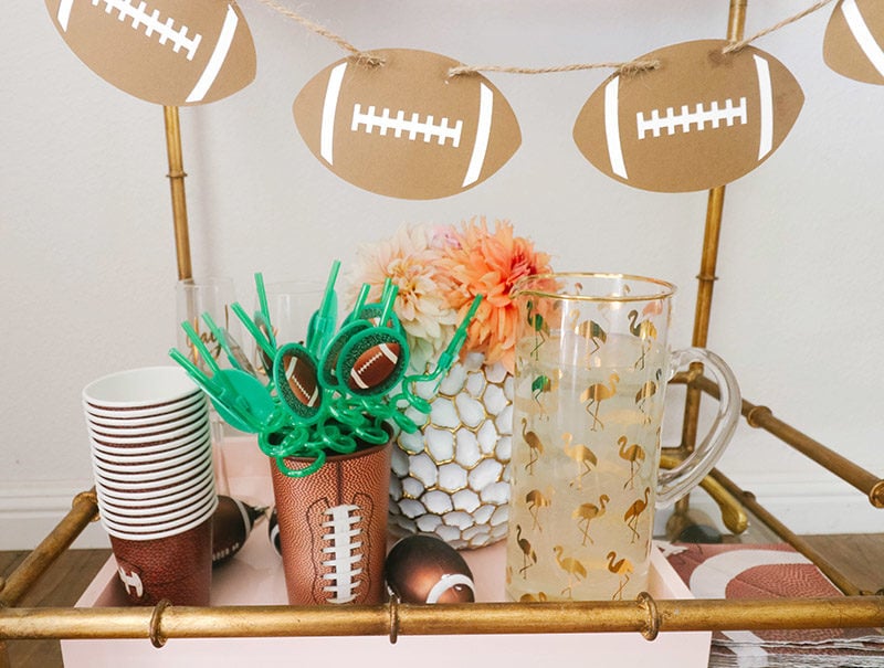 Lifestyle expert, Candie Anderson has the scoop on how she decorated her glam gold bar cart with football inspired decor! 