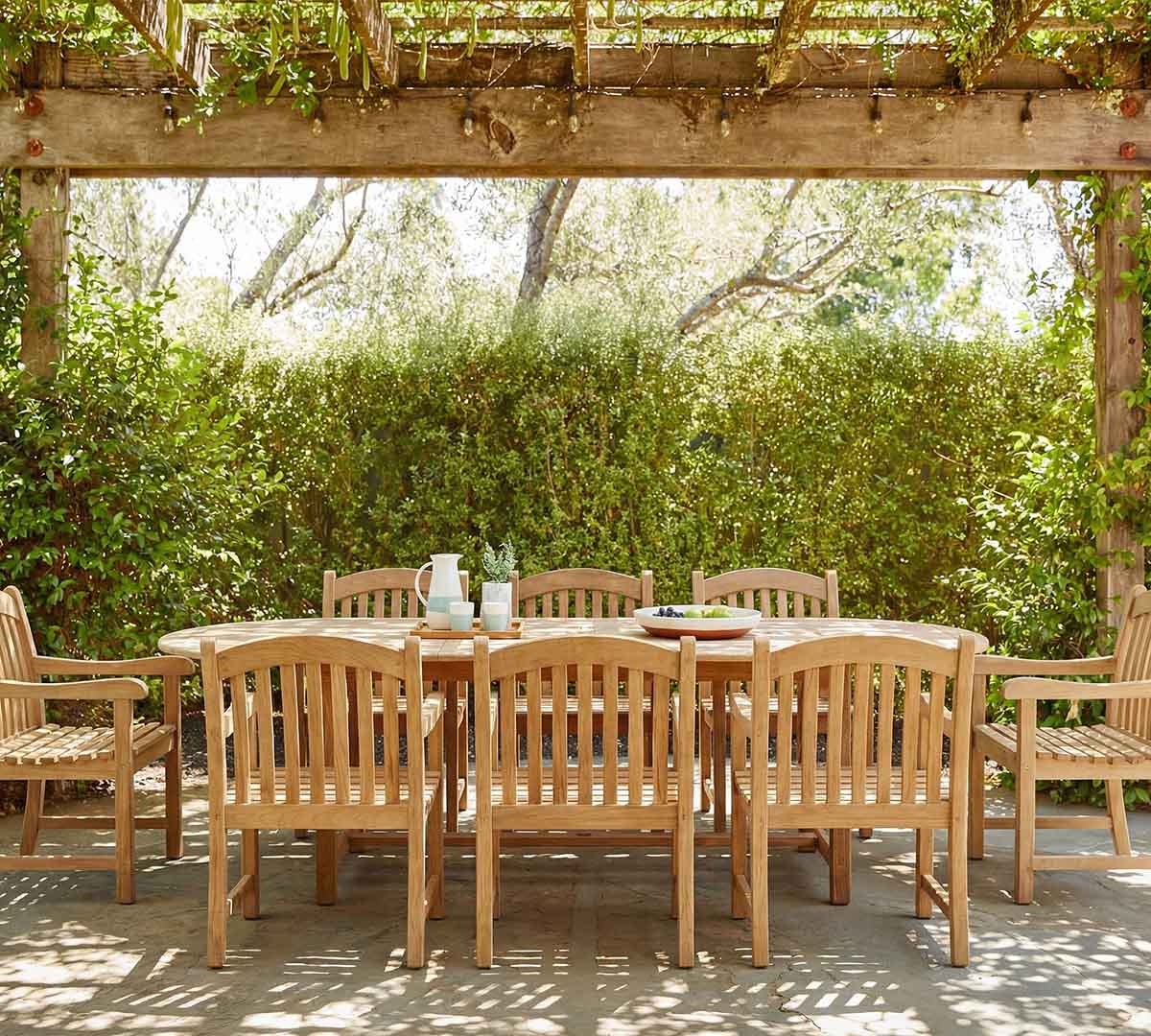 Pottery Barn Nassau 9-Piece Teak Oval Outdoor Table & Placid Teak Dining Armchair Set best pottery barn outdoor dining tables sale