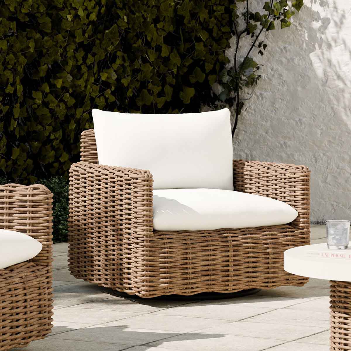 West Elm Westport Wicker Outdoor Slim Profile Swivel Chair Natural best outdoor wicker accent chairs