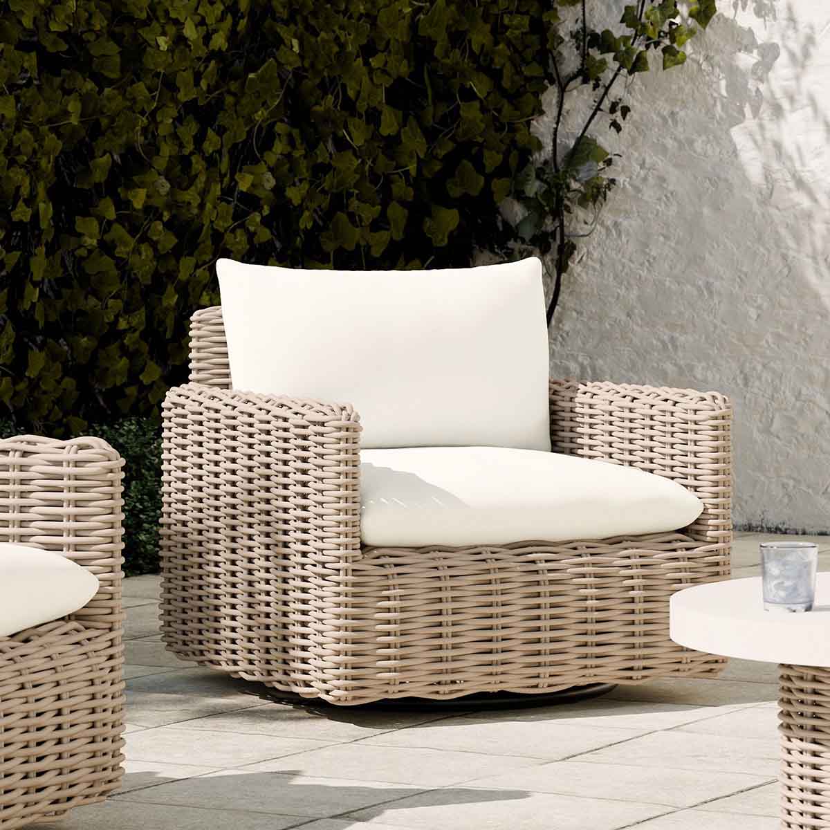 West Elm Westport Wicker Outdoor Slim Profile Swivel Chair Seashore best outdoor wicker accent chairs