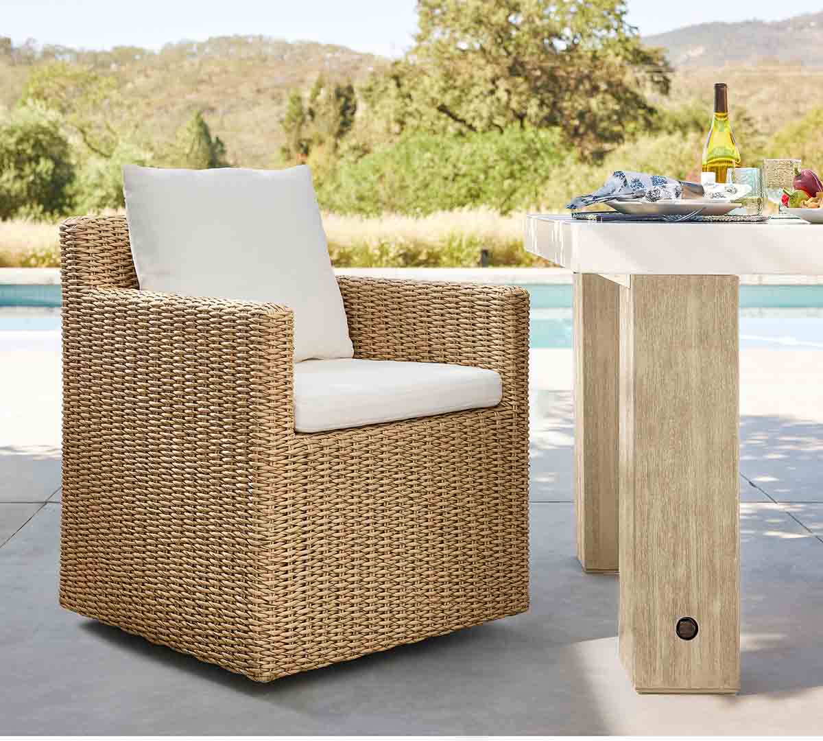 Pottery Barn Kostas Wicker Swivel Outdoor Dining Armchair best outdoor wicker dining chairs