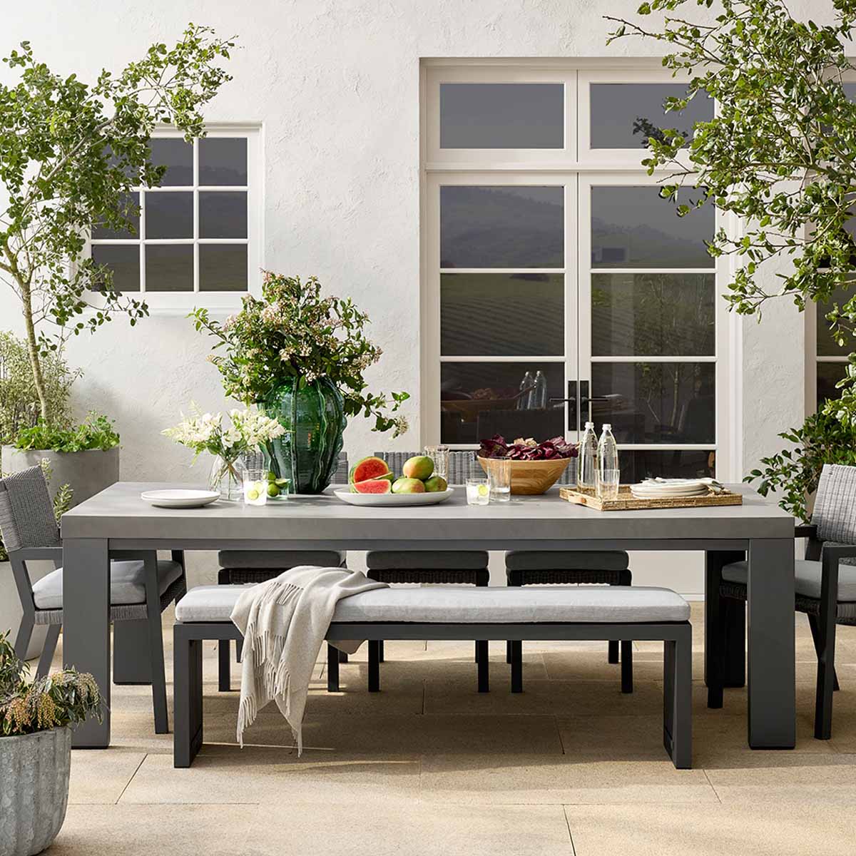 Williams Sonoma Larnaca Metal Fiberstone Dining Table best concrete outdoor dining tables