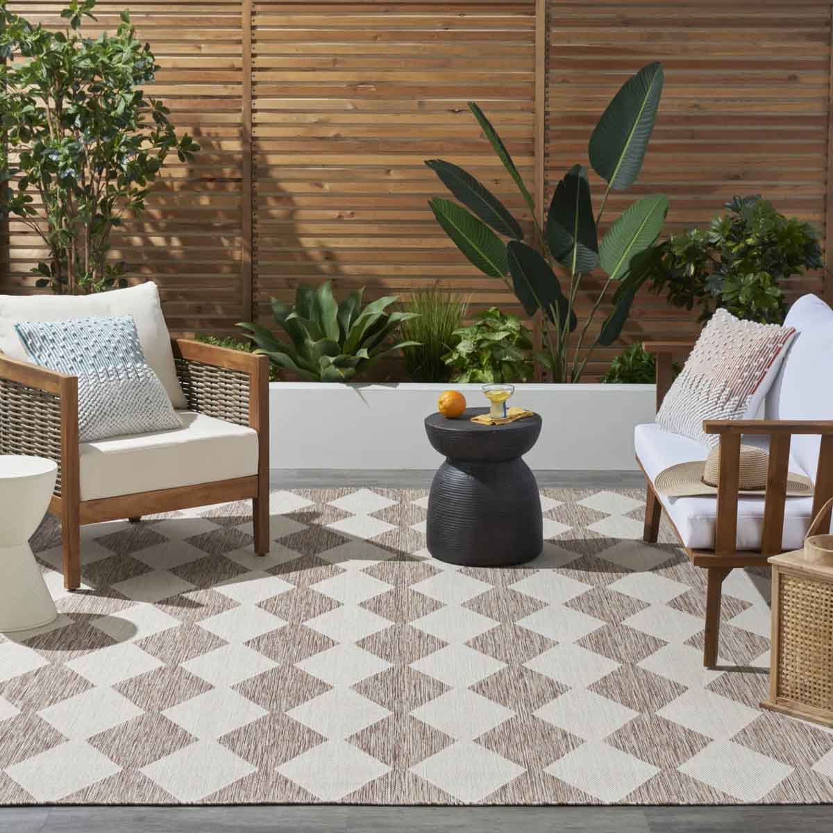 Ebern Designs Positano Indoor / Outdoor Rug Beige checkerboard geometric pattern neutral outdoor rugs best patio