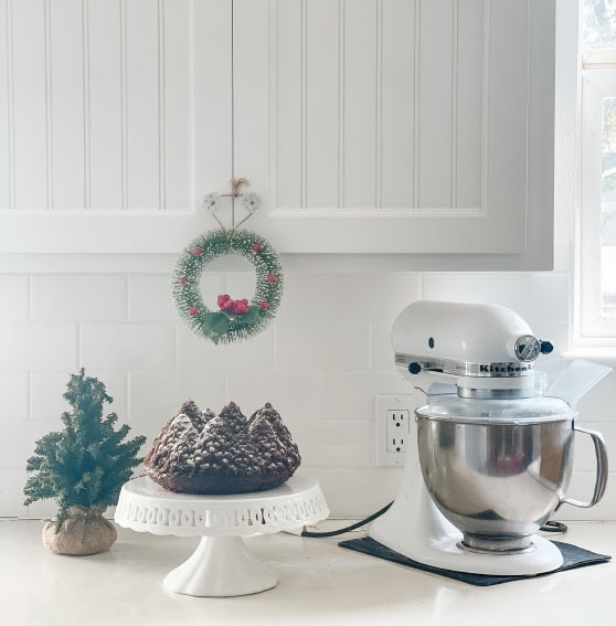 Entertaining expert, journalist and Christmas baking enthusiast, Candie Anderson of candieanderson.com shares her favorite chocolate Christmas tree cake that she made using her trusty Nordic Ware Pine Forest Bundt Cake Pan.