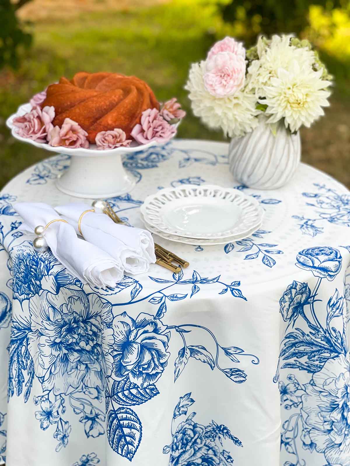 beautiful blue and white outdoor summer tablescape, which will also make a beautiful dessert table.