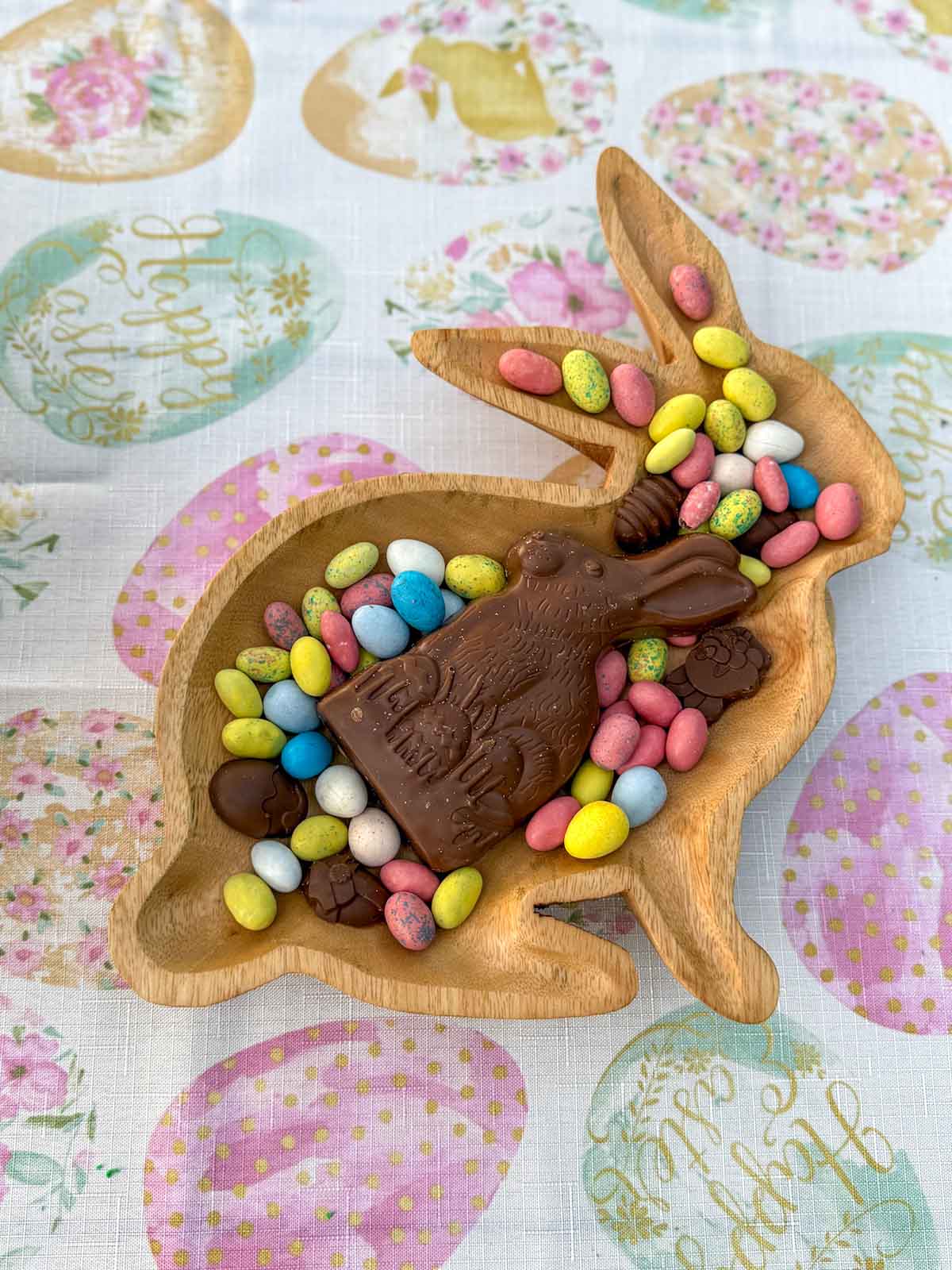 Entertaining expert, journalist and lifestyle blogger Candie Anderson of candieanderson.com shares her Easter bunny charcuterie board featuring a wooden bunny tray, a chocolate bunny, store-bought Easter candy and chocolate Easter candies she made using silicone molds.