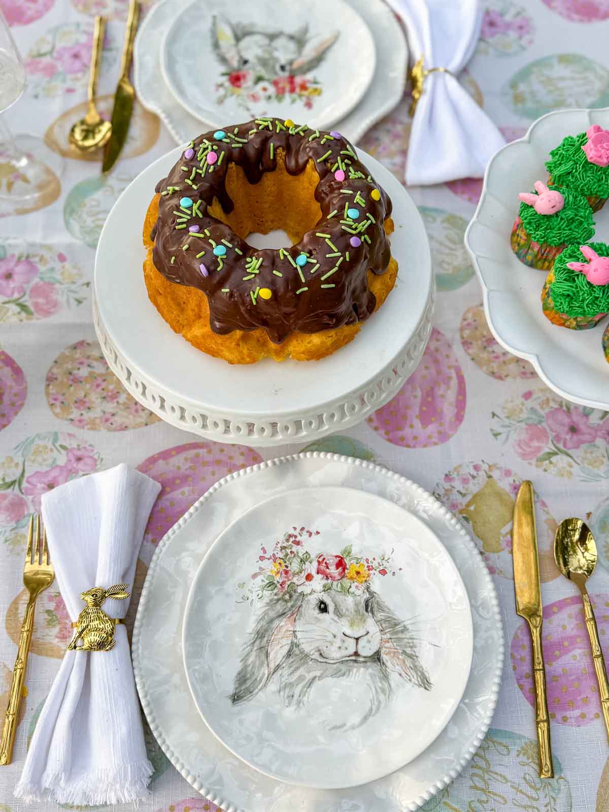 Entertaining expert, journalist and lifestyle blogger Candie Anderson of candieanderson.com shares her fun and festive Easter bunny plates on her whimsical Easter tablescape.