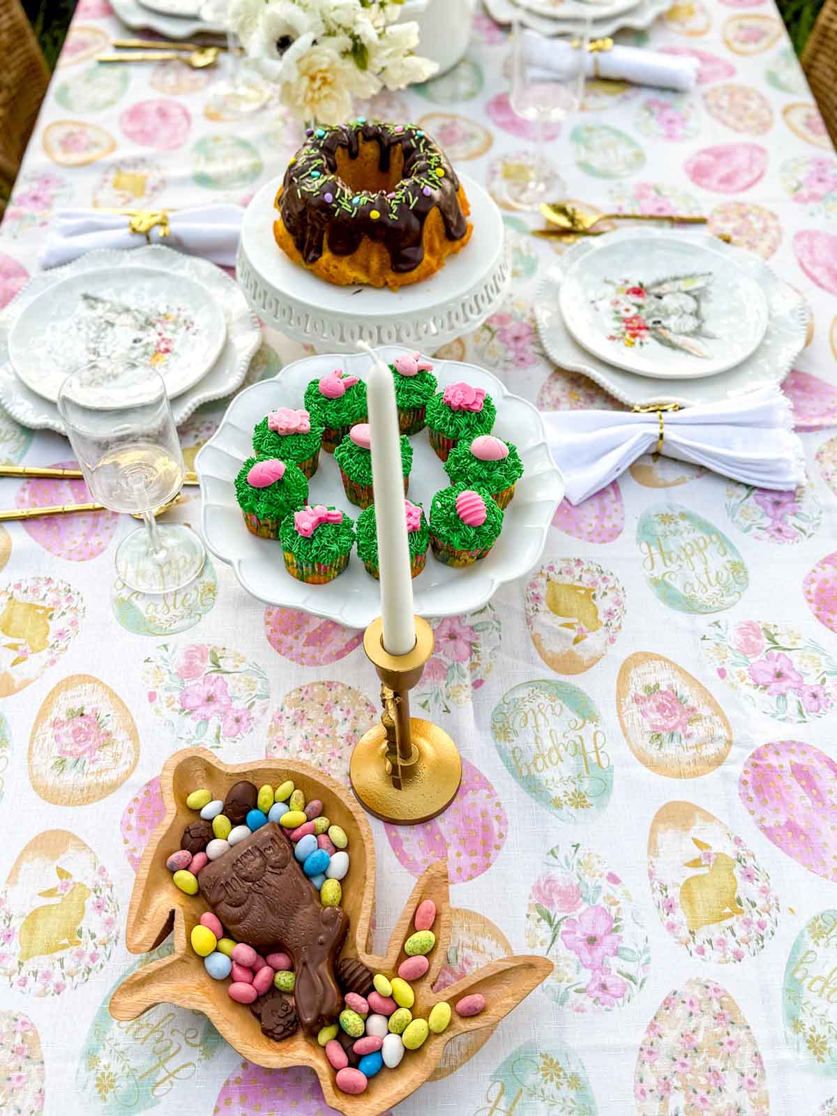 Entertaining expert, journalist and lifestyle blogger Candie Anderson of candieanderson.com shares her whimsical Easter tablescape featuring charming decor, gorgeous details, savory and sweet charcuterie boards, and delicious homemade food.