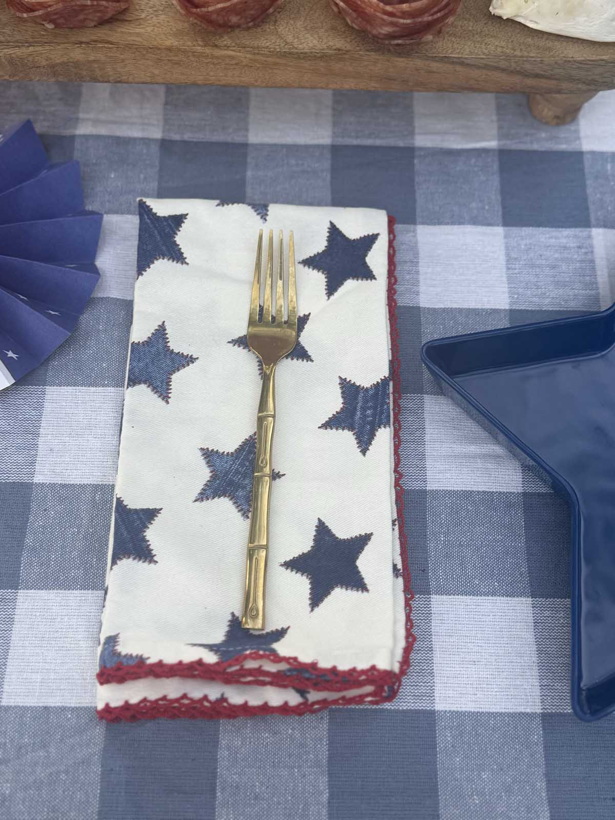 Entertaining expert, Candie Anderson shares how she accessorized her Americana napkins with gold faux bamboo flatware! They will really make a statement on your 4th of July tablescape!