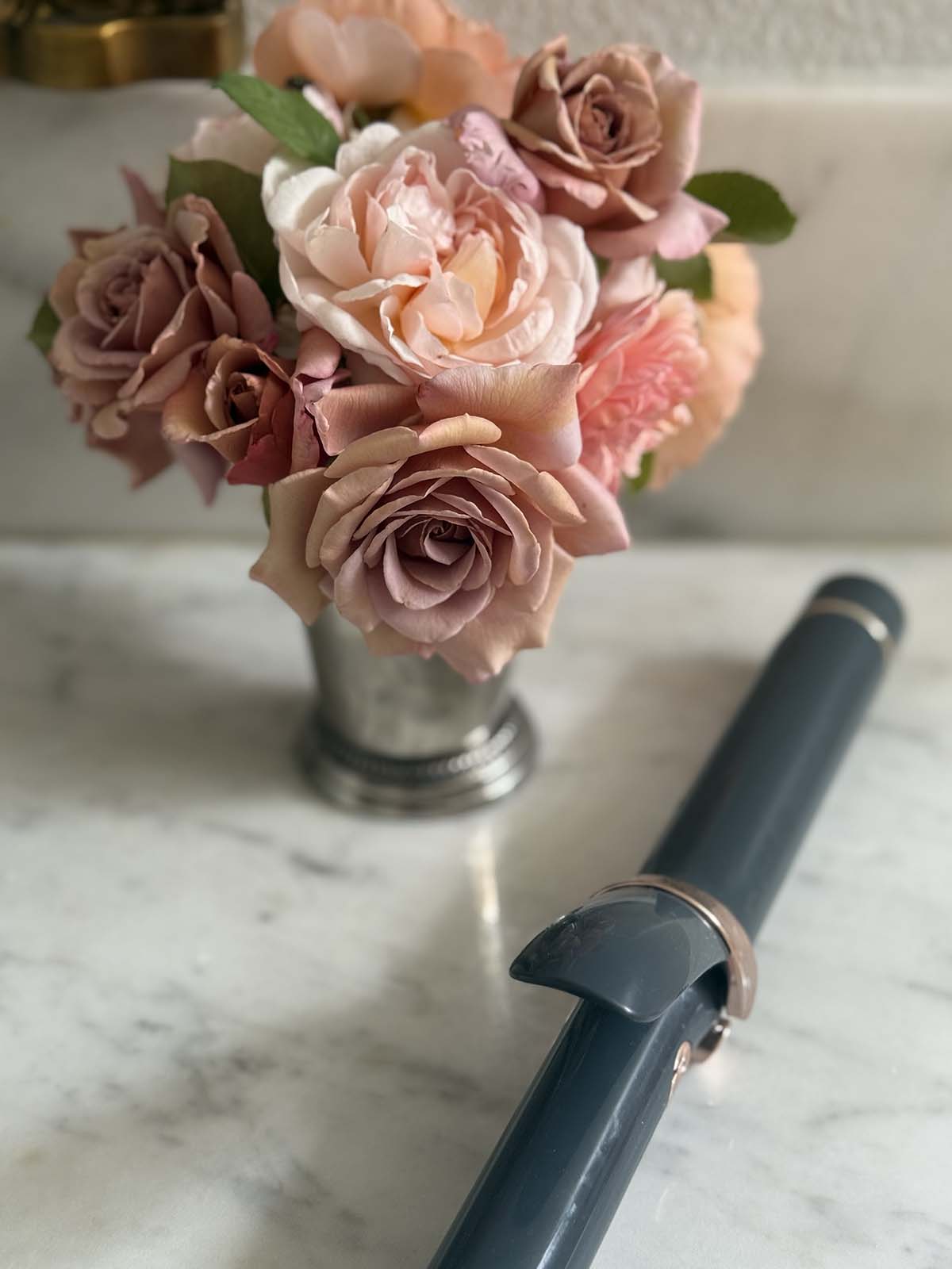 T3 SinglePass Curling Iron in limited edition blue from the 2025 Nordstrom Anniversary Sale, styled on candie anderson marble vanity