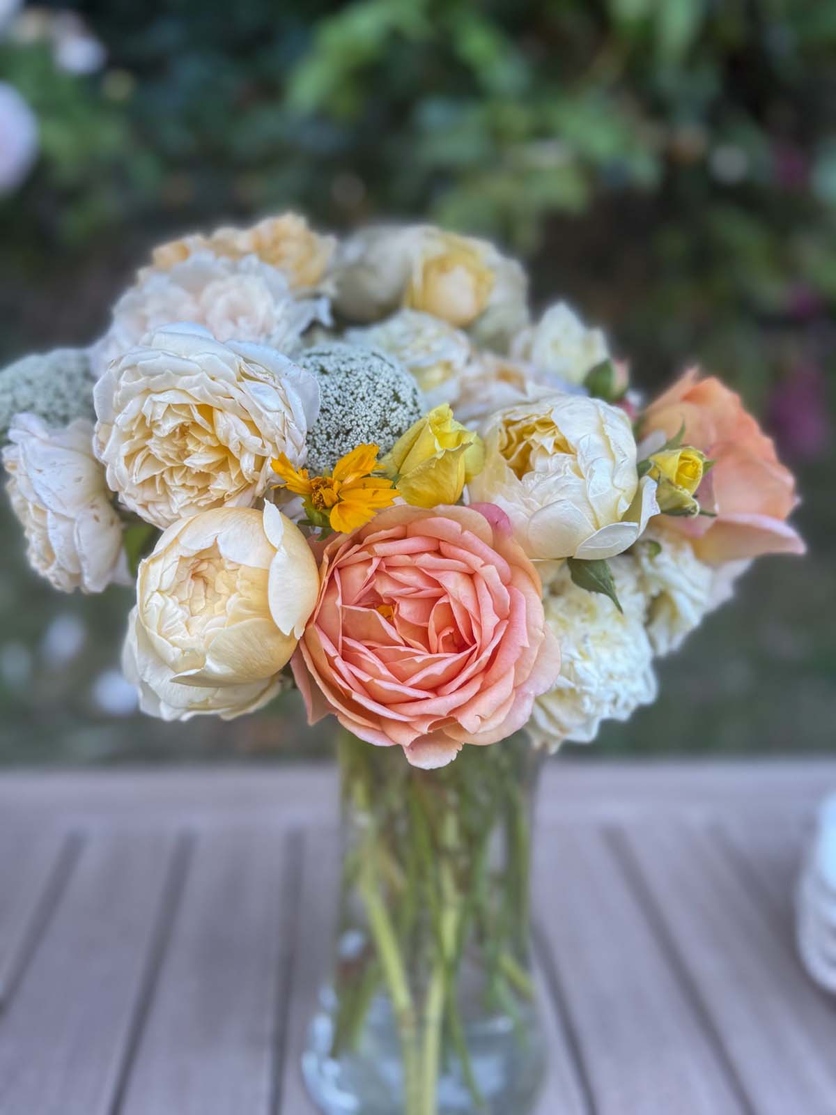 Entertaining expert, Candie Anderson shares her butter yellow garden rose bouquet in a glass vase.